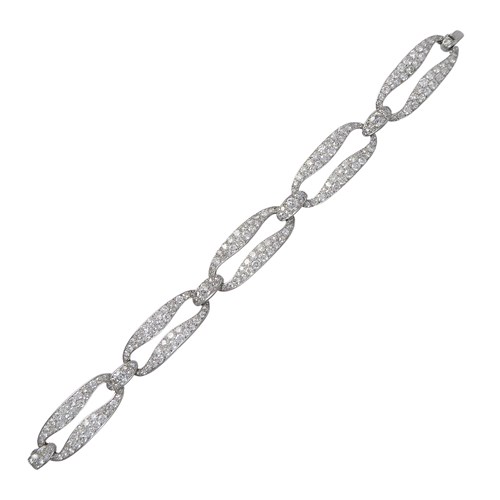 Art Deco diamond set open link bracelet by Cartier, c.1925, with five elongated oval-oblong links,